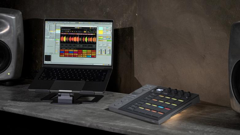 Serato SLAB, a Studio-native MIDI pad controller connected to a laptop running Serato Sample in a studio setup.