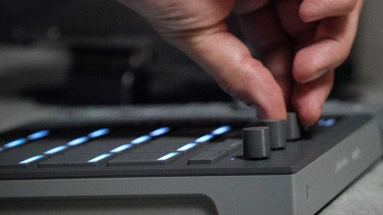 Close-up of Serato SLAB, a Studio-native MIDI pad controller, showing per-pad control knobs.