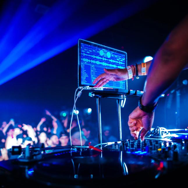 Close up of a DJ using Serato DJ Pro in a live venue